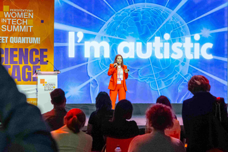 Barbara standing on the Science Stage at the Women in Tech Summit